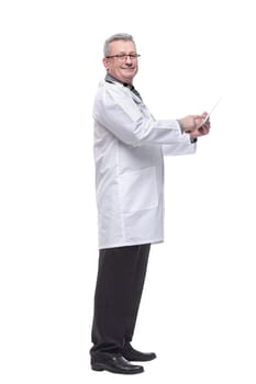 Full length portrait of male doctor using digital tablet isolated on white. Electronic medical record system, health and technology, telemedicine concept