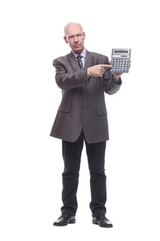 in full growth.business man with a calculator. isolated on a white background.