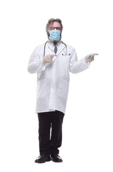 in full growth. doctor therapist in a protective mask . isolated on a white background