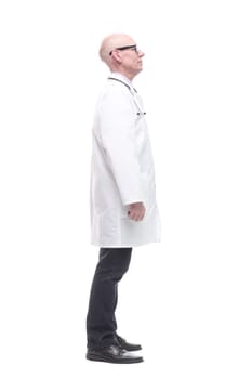 in full growth. senior doctor with a stethoscope. isolated on a white background.