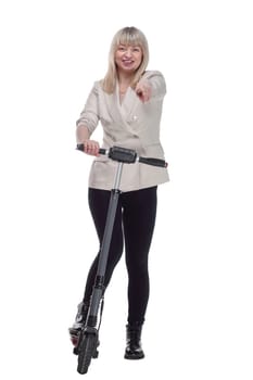 in full growth. smiling adult woman with an electric scooter . isolated on a white background.