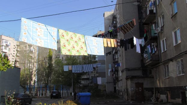 Soviet architecture with laundry drying between high-rise buildings. High quality photo