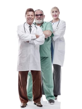 in full growth. successful female doctor standing in front of her colleagues . isolated on a white