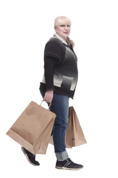 full-length. casual woman in jeans with shopping bags. isolated on a white background.