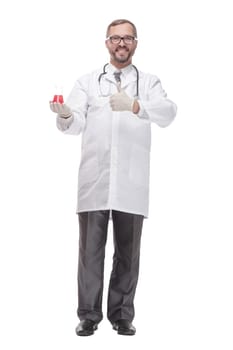 smiling doctor with a laboratory flask in his hands . isolated on a white background.