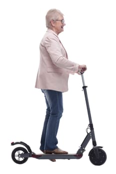 side view. modern elderly woman with electric scooter. isolated on a white background