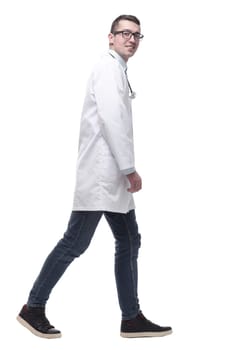 doctor in a white coat striding forward. isolated on a white background.
