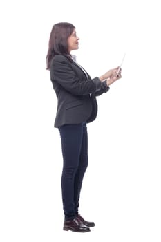 Full length portrait of attentive modern business woman with clipboard and pen looking at camera