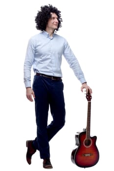 in full growth. a cheerful curly-haired man with a guitar . isolated on a white background
