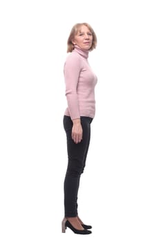 Full length, side view of a confident business woman standing with folded hands isolated over white background