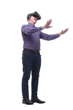 Excited man experiencing virtual reality via VR headset and touching something with his hands isolated on white background
