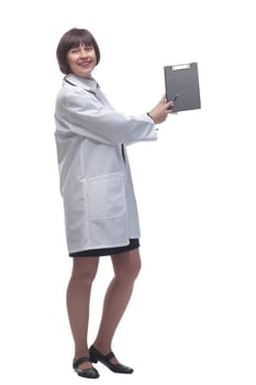 side view. female medic making notes to the clipboard . isolated on a white background.
