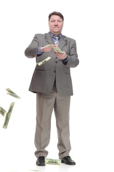 in full growth. happy man with dollar bills. isolated on a white background.