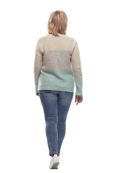 full-length. casual woman in jeans striding forward. isolated on a white background.