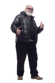 in full growth. contented bearded man in a winter jacket giving a thumbs up. isolated on a white background.