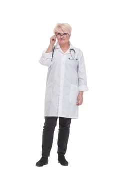 in full growth. competent doctor with a clipboard. isolated on a white background.