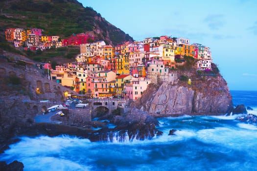 Manarola fisherman village in a dramatic wind storm. Manarola is one of five famous villages of Cinque Terre, suspended between sea and land on sheer cliffs upon the wild waves.