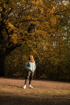 Autumn portrait of beautiful woman on fall nature background