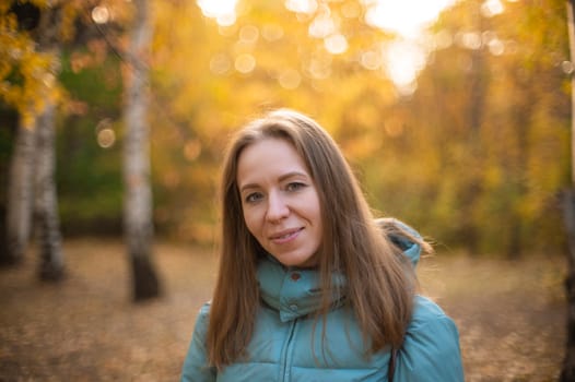 Autumn portrait of beautiful woman on fall nature background
