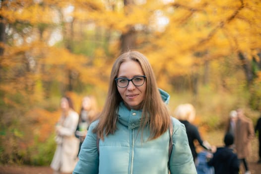 Autumn portrait of beautiful woman on fall nature background