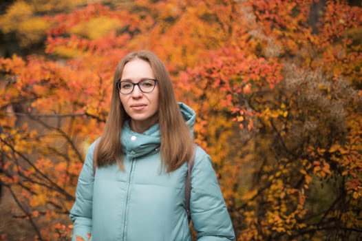 Autumn portrait of beautiful woman on fall nature background