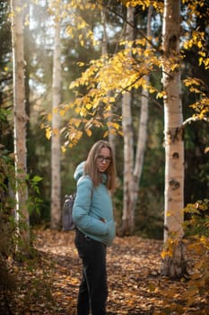 Autumn portrait of beautiful woman on fall nature background