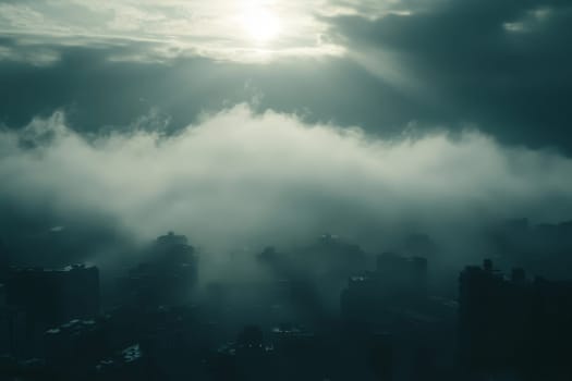 Dramatic aerial view of a city skyline shrouded in mist with sunbeams piercing through dark clouds.
