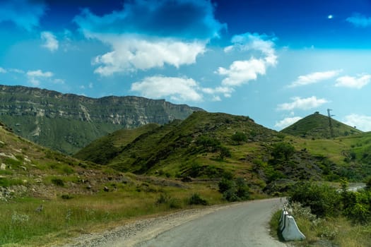 View from the car of an asphalt road in the mountainous area of Dagestan.