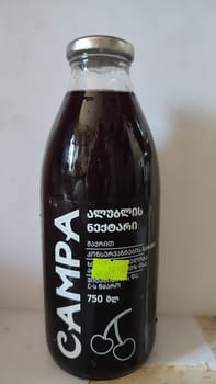 03 July 2024 Beer-Sheva Israel, food stor ,grape juice in glass bottle, drink product. High quality photo