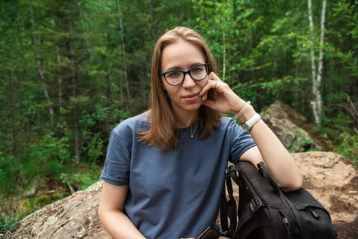 Healthy lifestyle woman walking and restiing in summer forest area