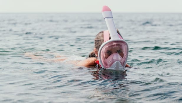 Young happy woman in white bikini put pink snorkeling mask on beach before swimming. girl having fun relaxing on beautiful beach. Beach lifestyle