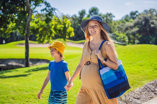 Expectant mother and her son enjoying a leisurely stroll in the park, cherishing precious moments amidst nature's beauty.