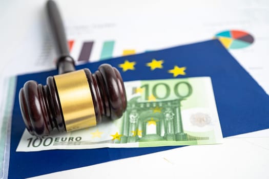 Gavel for judge lawyer and Euro dollar banknotes on EU flag, finance concept.