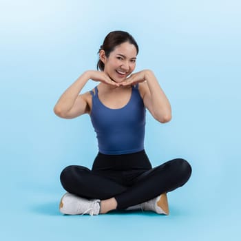 Full body asian woman in sportswear portrait, smiling and posing cheerful gesture. Workout training with attractive girl engage in her pursuit of healthy lifestyle. Isolated background Vigorous