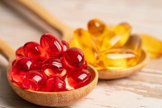 Red jelly capsules with fish oil Omega 3  vitamin with EPA and DHA.