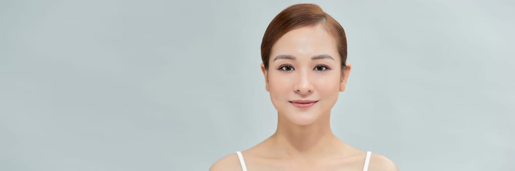 Web banner. Smiling asian woman touching healthy skin portrait