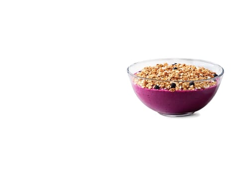 Vegan berry smoothie bowl with granola and coconut flakes served in a transparent glass bowl. Food isolated on transparent background.