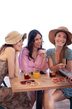 Young women holding a credit card and making a payment transaction.
