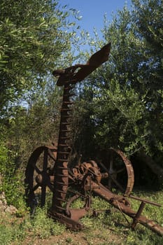 Ancient land plowing metal adjustment on wheels in Cyprus park