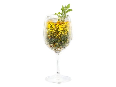 Herbal Tea A blend of herbal tea in a glass with various herbs and flowers. Drink isolated on transparent background.