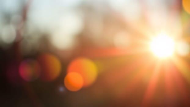 Light pours from a warm, bright rainbow in blur on a black background with a dusty texture. Use this defocused, abstract, damaged, scratched, retro cinema analog effect as a screen filter or overlay for image. High quality photo