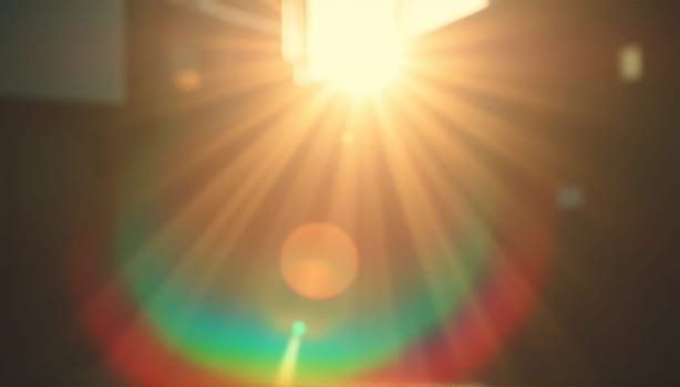 Light pours from a warm, bright rainbow in blur on a black background with a dusty texture. Use this defocused, abstract, damaged, scratched, retro cinema analog effect as a screen filter or overlay for image. High quality photo