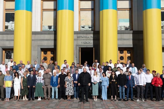 KYIV, UKRAINE - Aug. 23, 2024: A solemn ceremony near the Verkhovna Rada on State Flag Day. Speaker Ruslan Stefanchuk speaks