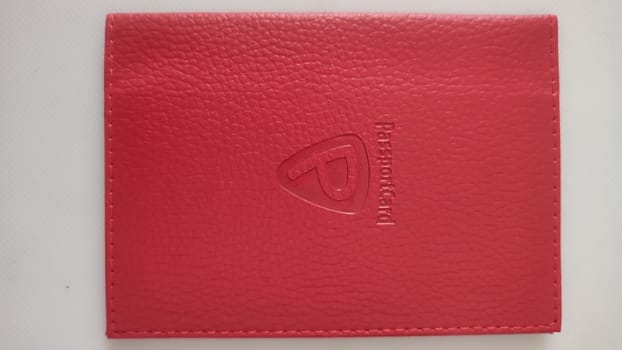 04 July 2024 Beer-Sheva Israel, insurance company Passport card, red cover for cards. High quality photo