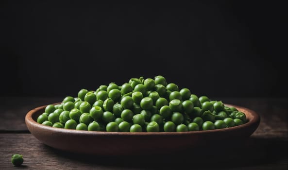 A bowl of freshly harvested green peas sits on a wooden table with a dark background.