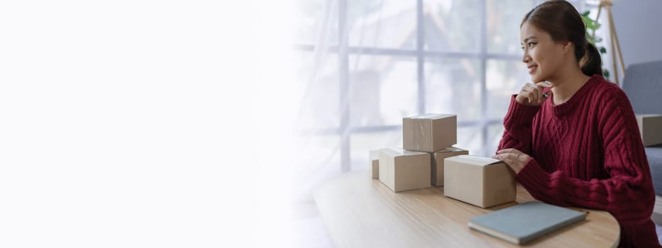 woman, online seller, efficiently manages customer orders and delivery through the e-commerce platform.