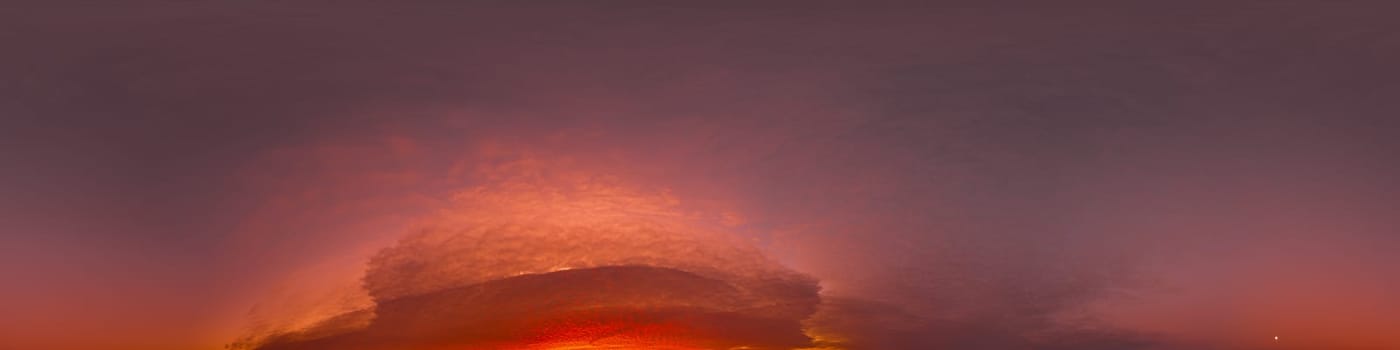 Dramatic Sunset sky 360 panorama. Vibrant sky with bright glowing red pink Cumulus clouds. HDR 360 seamless spherical panorama. Sky dome for aerial drone panoramas. Climate and weather change