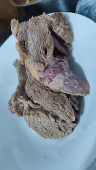 boiled meat beef on white plate, breakfast lunch dinner, food cooking, protein. High quality photo