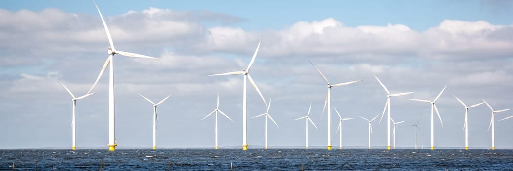 ocean Wind Farm. Windmill farm in the ocean. Offshore wind turbines in the sea. Wind turbine from an aerial view, in the Netherlands