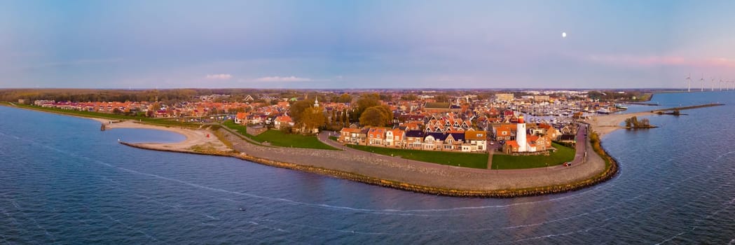 Lighthouse of Urk Netherlands during sunset in the Netherlands. drone aerial view of old Dutch fishing village in Flevoland